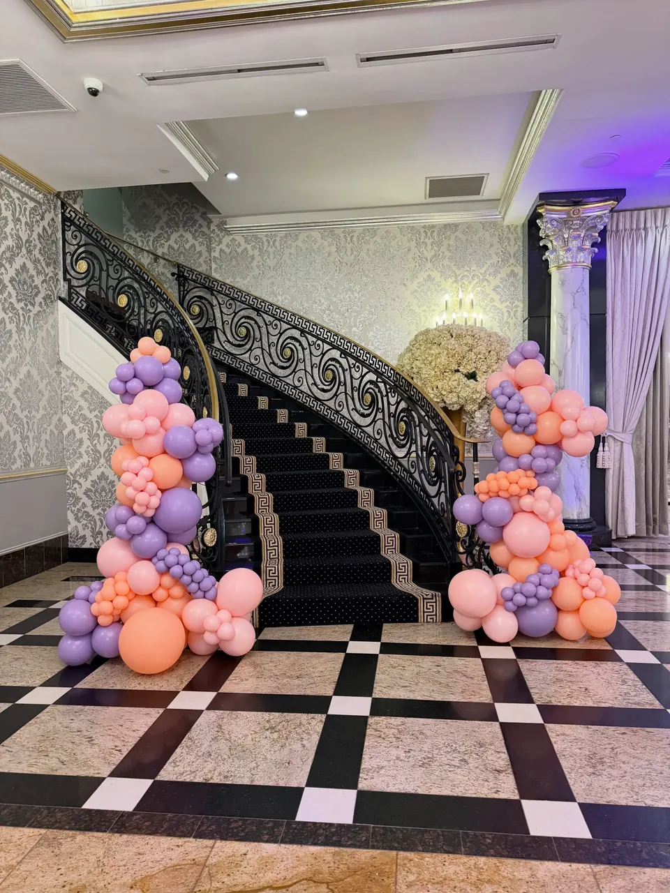 Freestanding pastel garlands at the grand staircase of The Venetian